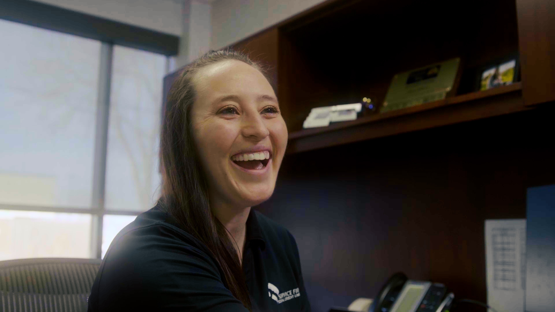 Friendly Service First employee talking to a member