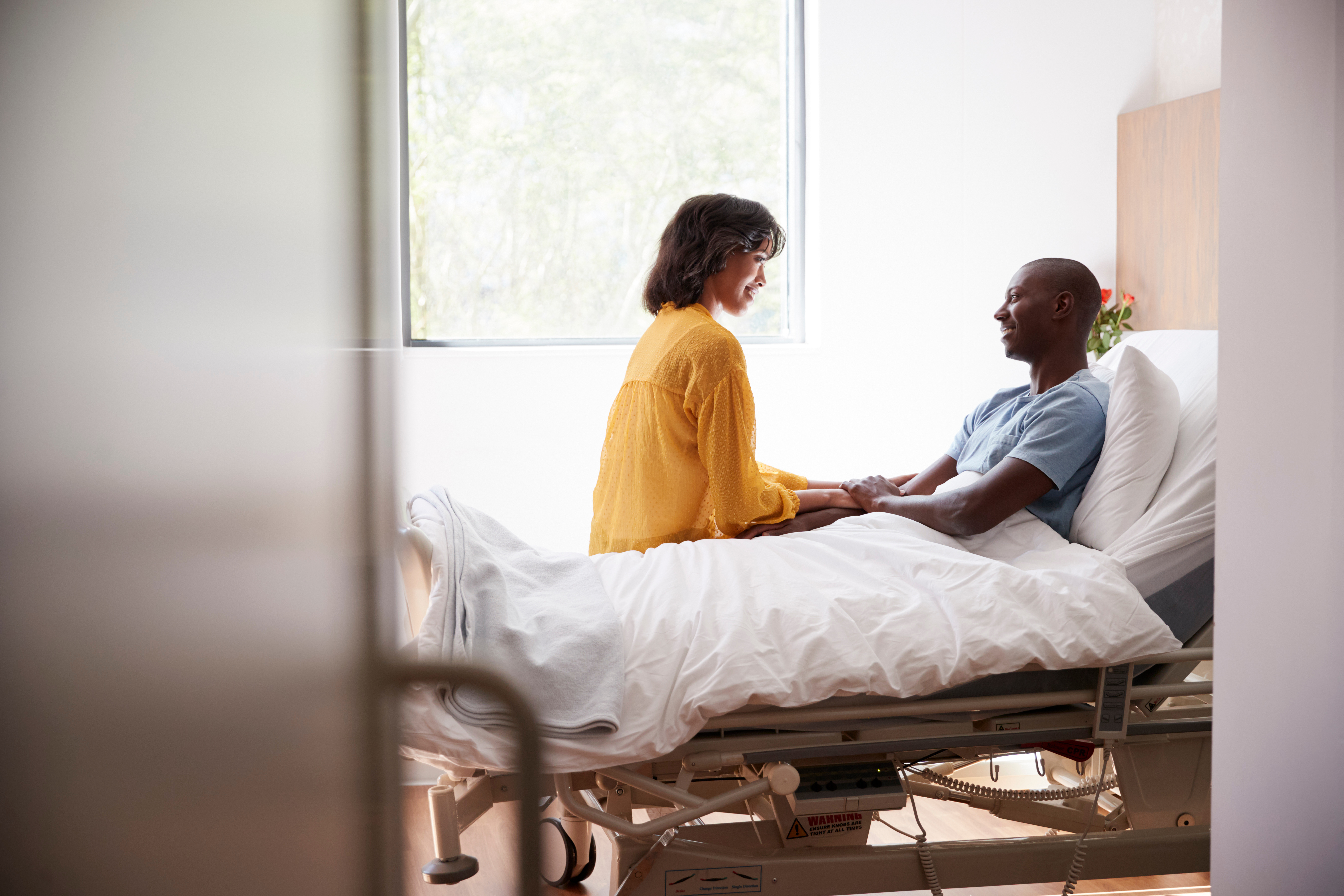 woman visiting her husband in the hospital
