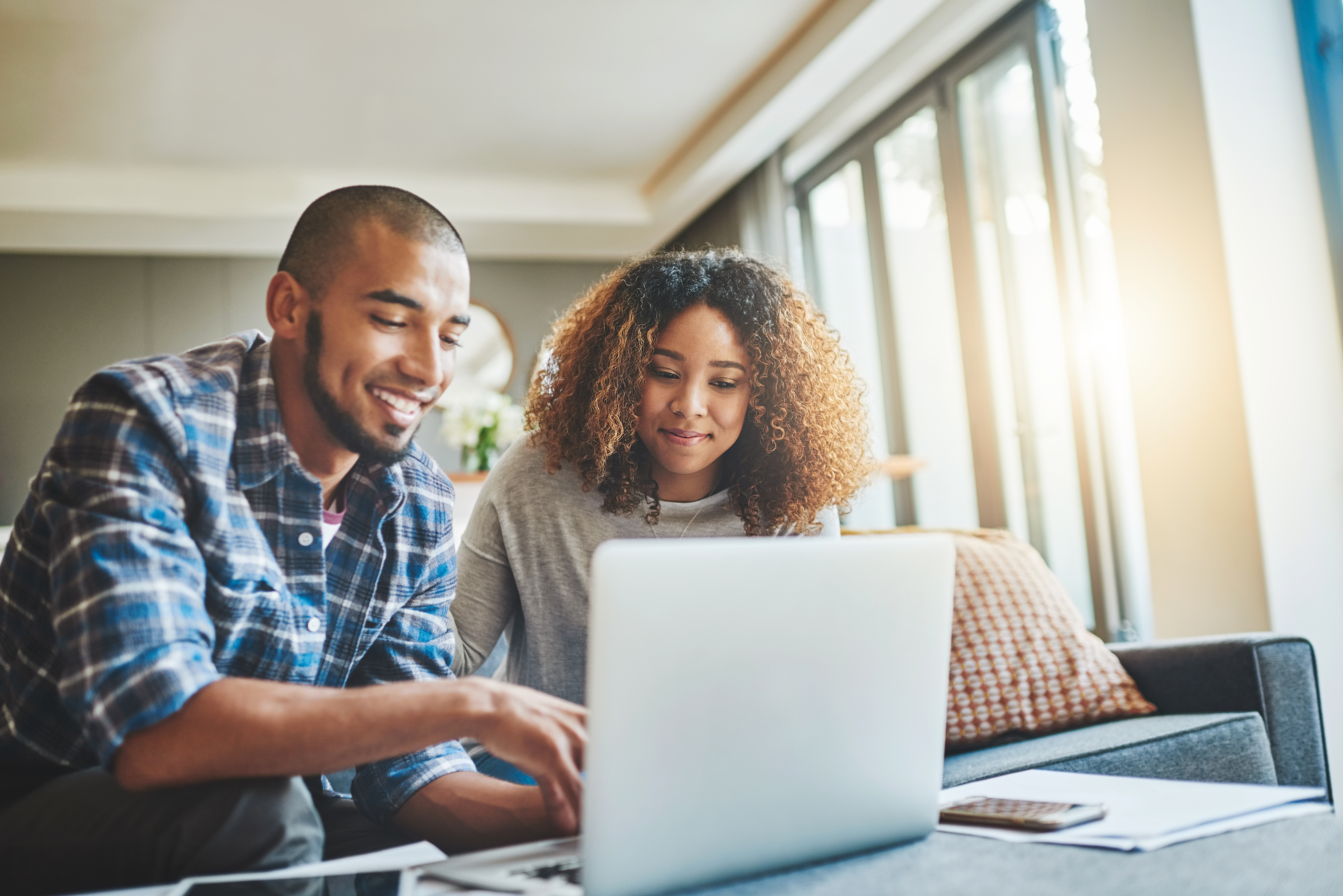 couple on laptop working on their finances